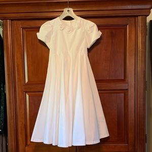 Storybook white satin girls dress with rosette accents